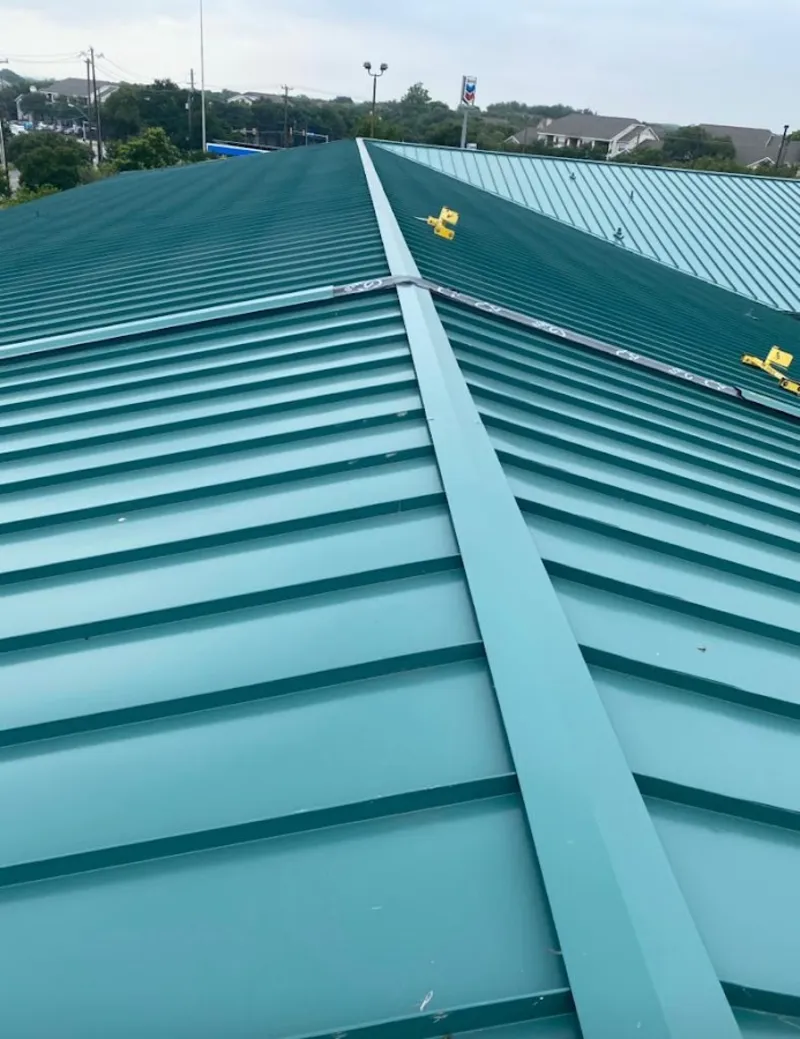 Green commercial metal roof ridge and valley for Metal Roof Repair in East Fallowfield